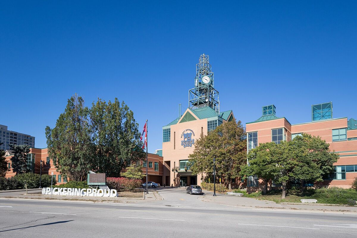 Pickering City Hall with its clock tower under a clear blue sky