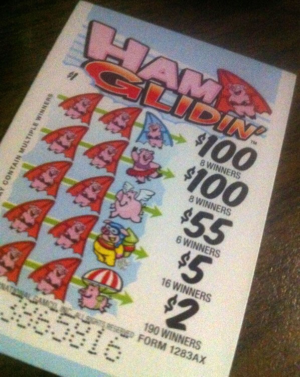 A pull-tab style break open lottery ticket showing prize tiers from $2 to $100