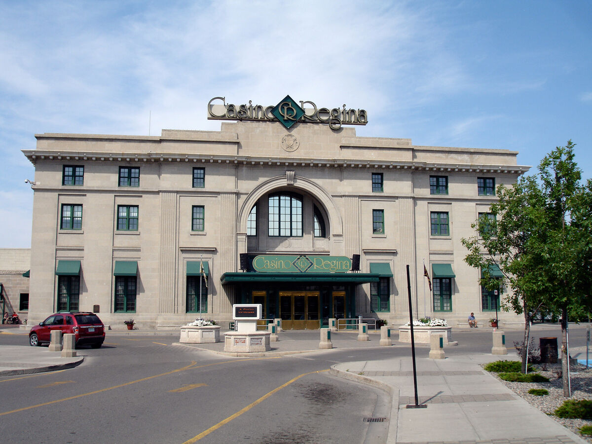 The stone front entrance of Casino Regina, a former railway station