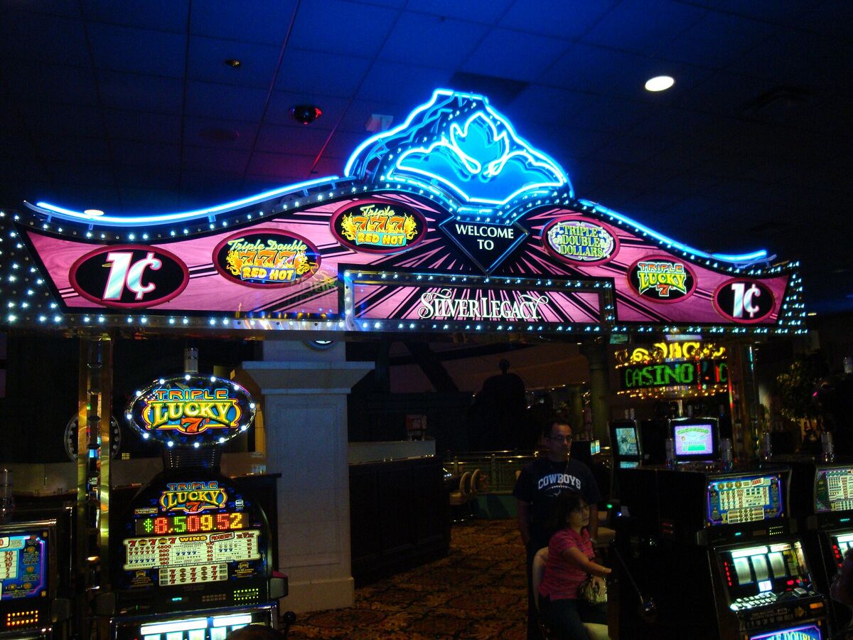 Rows of slot machines on a casino floor.