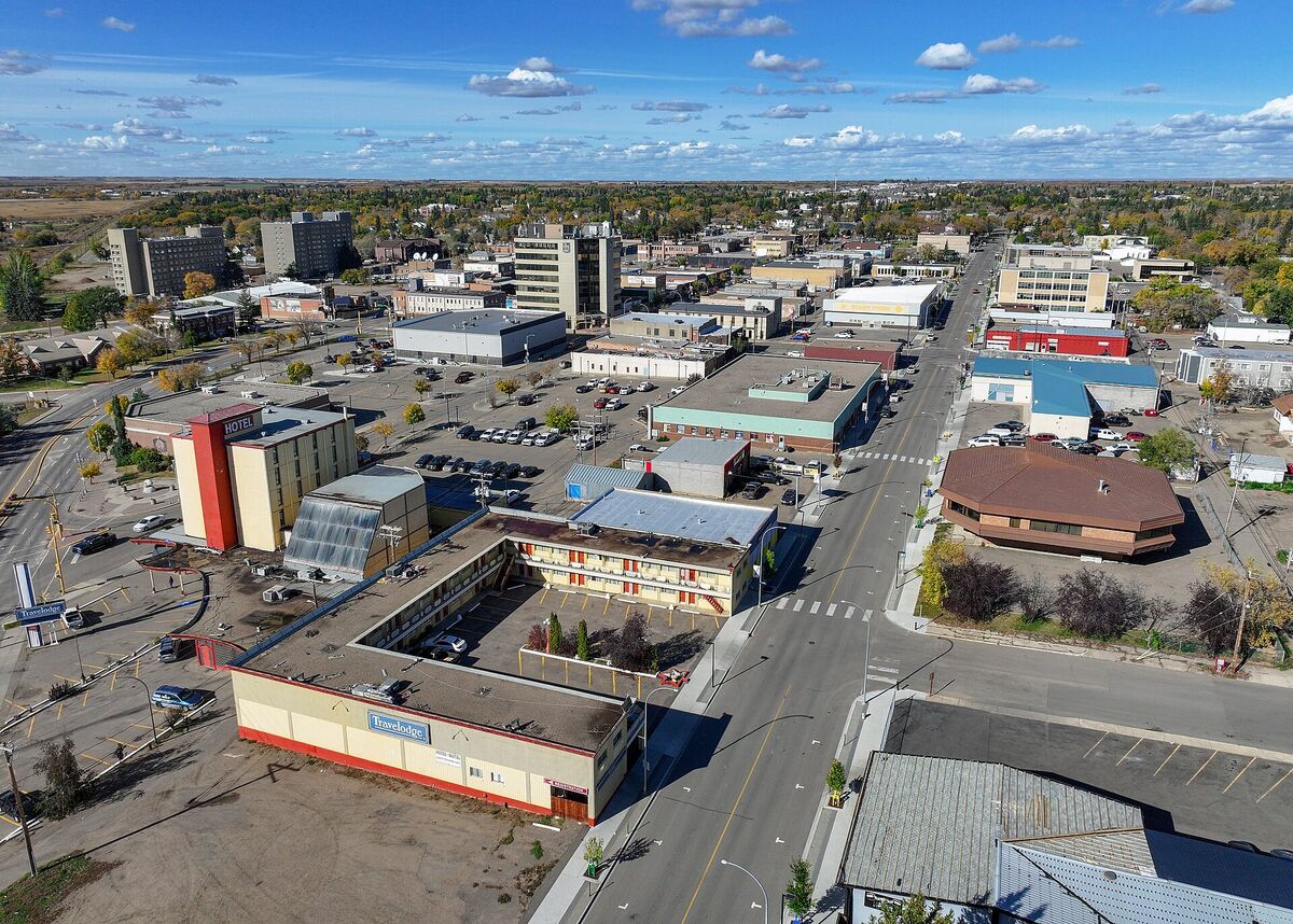 Aerial view of downtown North Battleford with low-rise buildings and prairie beyond