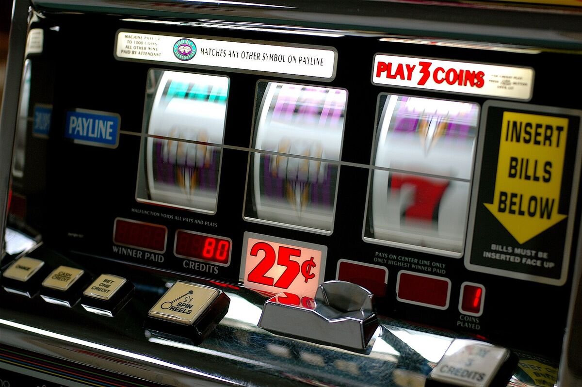 Close-up of a three-reel slot machine with a 25 cent sign