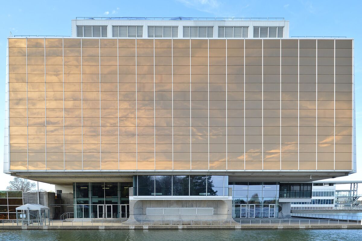The modernist exterior of the Montreal Casino with reflective panels above the water