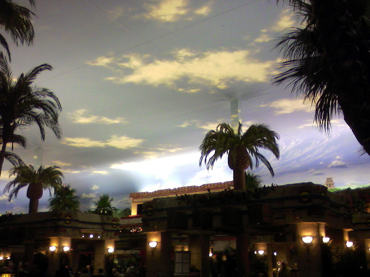 Palm trees and a painted sky ceiling inside Club Regent Casino in Winnipeg