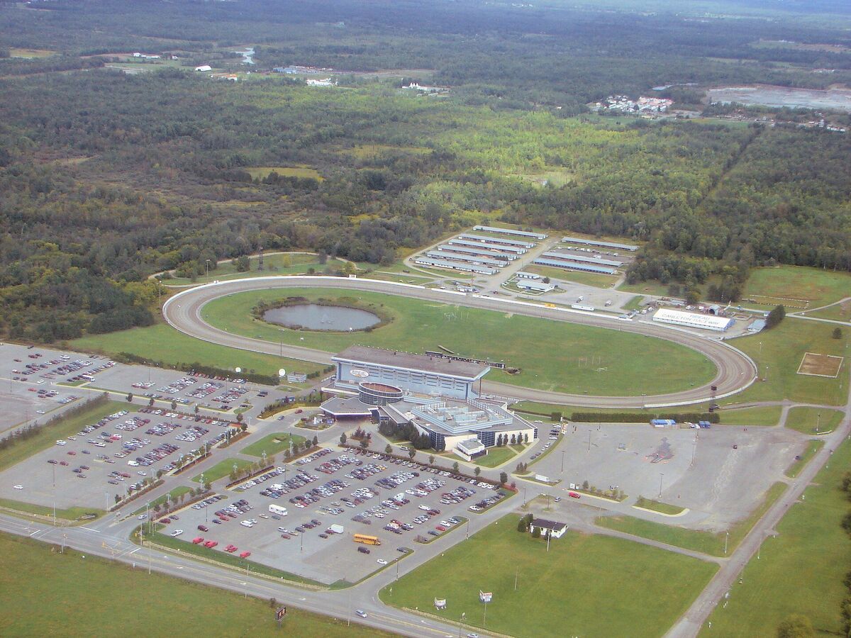 Aerial view of Rideau Carleton Raceway with its oval track, barns, casino and parking lots