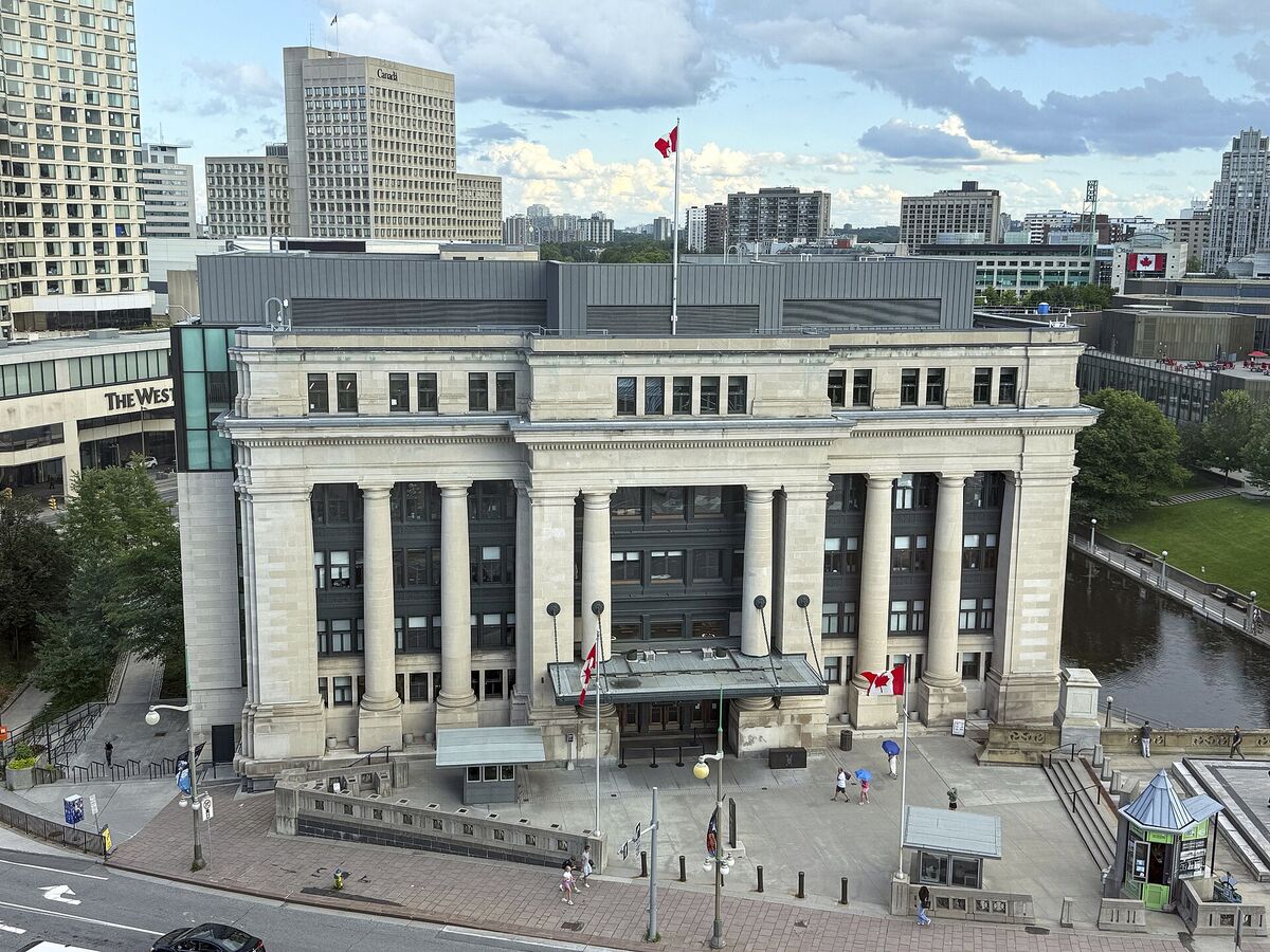 The Senate of Canada Building, a former train station with large stone columns, in Ottawa
